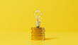 Leinwandbild Motiv Rising energy cost concept. Light bulb on top of a stack of gold coins. 3D Rendering