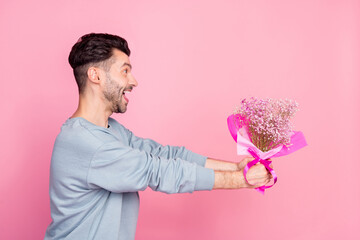 Sticker - Profile portrait of excited positive person arms hold give flowers bouquet look empty space isolated on pink color background