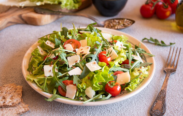 Canvas Print - Fresh vegetable salad with tomatoes, arugola, parmesan cheese and other ingredients, healthy eating