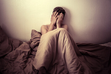 Wall Mural - Sad Young Man in the Bed