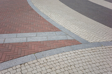  street pavement made of stone tiles lined