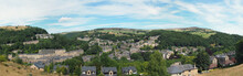 Panoramic View Of Hebden Bridge Showing Streets And The Town Centre Surrounded By Pennine Countryside In Summer Sunlight