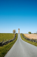 A Fence Lined Road Through Fields At Antietam Battlefield, Maryland