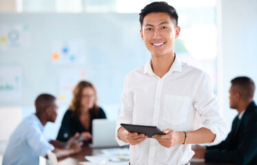 Portrait of business man working on tablet in office, planning with team in meeting and management of corporate teamwork seminar. Happy manager or worker in communication on technology at company