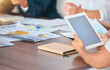 © Sanele G/peopleimages.com - Tablet, business meeting and mock up screen at corporate office desk with investors or team. Management, notes and analytics data report on digital technology for conference or presentation.