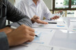 © ijeab - Asisan businessman teamwork meeting and discussing the investment data and report graph.