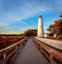 Ocracoke Lighthouse On Ocracoke , North Carolina At Sunset.The Lighthouse Was Built To Help Guide Ships Through Ocracoke Inlet Into Pamlico Sound.