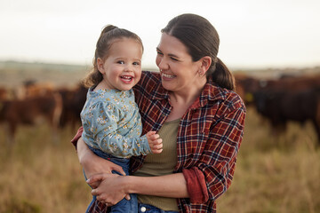 mother and daughter, love and family on a farm as a cattle farmer and child in the farming or agricu
