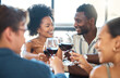© Kirsten Davis/peopleimages.com - Friendship, celebration and luxury wine toast with a fun group at an event or restaurant, bonding and talking. Happy, diverse friends enjoying a wine tasting and fine dining, celebrating good news