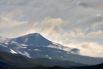 Sticker - Clouds over mountainous terrain in morning