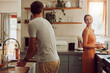 © Kay Abrahams/peopleimages.com - Couple cooking food, household cleaning or food preparation together in their kitchen at home. Laughing, bonding and caring husband and wife helping each other prepare supper, lunch or meal