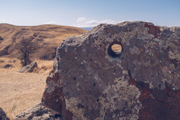 Megalithic standing stones and burial mound of Zorats Karer or Carahunge - prehistoric monument in Armenia. Armenian Stonehenge stock photography