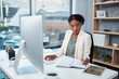 © Chanelle Malambo/peopleimages.com - Finance manager writing notes, typing on a computer keyboard and planning to check financial data in office. Serious boss thinking, arranging tax deadlines or scheduling business meetings in notebook