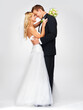 Wedding smile, couple hug and white background studio portrait. Happy and in love man and beautiful young woman, marriage flowers bouquet in bride hand and lean to kiss husbands cheerful face.