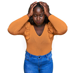 Sticker - Young african woman wearing casual clothes suffering from headache desperate and stressed because pain and migraine. hands on head.