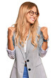 © Krakenimages.com - Beautiful blonde young woman wearing business clothes very happy and excited doing winner gesture with arms raised, smiling and screaming for success. celebration concept.