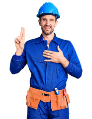 Sticker - Young handsome man wearing worker uniform and hardhat smiling swearing with hand on chest and fingers up, making a loyalty promise oath