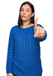 © Krakenimages.com - Young hispanic woman wearing casual clothes pointing with finger up and angry expression, showing no gesture