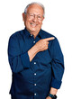 © Krakenimages.com - Senior man with grey hair wearing casual shirt and glasses cheerful with a smile of face pointing with hand and finger up to the side with happy and natural expression on face