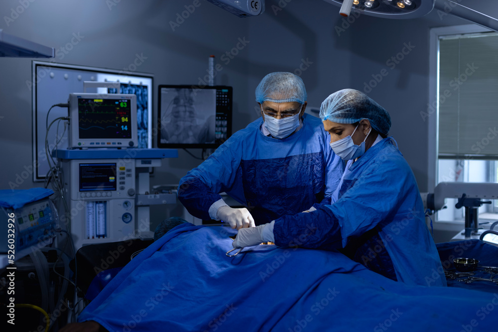 Two doctor surgeons operating patient at hospital Stock Photo | Adobe Stock