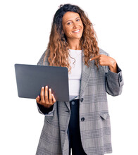 Young Hispanic Woman With Tattoo Holding Laptop Pointing Finger To One Self Smiling Happy And Proud