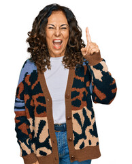 Poster - Middle age hispanic woman wearing casual clothes pointing finger up with successful idea. exited and happy. number one.