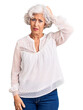 © Krakenimages.com - Senior grey-haired woman wearing casual clothes confuse and wonder about question. uncertain with doubt, thinking with hand on head. pensive concept.