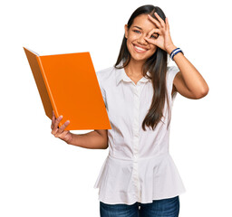 Sticker - Beautiful hispanic woman reading book smiling happy doing ok sign with hand on eye looking through fingers