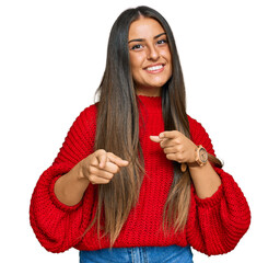 Canvas Print - Beautiful hispanic woman wearing casual clothes pointing fingers to camera with happy and funny face. good energy and vibes.