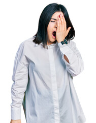 Poster - Young brunette woman with blue eyes wearing oversize white shirt yawning tired covering half face, eye and mouth with hand. face hurts in pain.