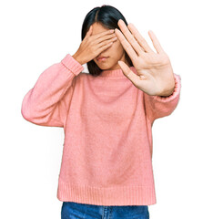 Sticker - Beautiful young asian woman wearing casual winter sweater covering eyes with hands and doing stop gesture with sad and fear expression. embarrassed and negative concept.