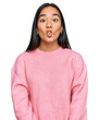 © Krakenimages.com - Young asian woman wearing casual winter sweater making fish face with lips, crazy and comical gesture. funny expression.