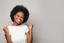  Happy Attractive Woman Expressing Winning Gesture