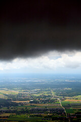 Wall Mural - Dark, stormy clouds over Poland. View from the plane, polish landscape and dark clouds