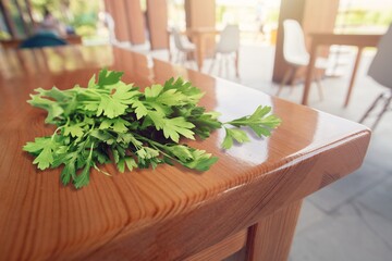 Poster - Fresh tasty aroma parsley on the table. Green parsley.