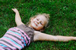 © Anastasiia K. - The child lies on the grass. Cute baby 5 years old is resting on a green lawn. Copy space.