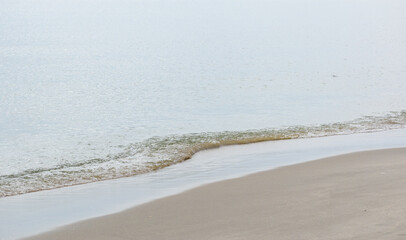 Wall Mural - Background with Calm Ocean Waters Along Shoreline at the Beach