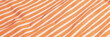 Beautiful orange fabric with white stripes background. Draped background of fabric, texture. Abstract background. Banner