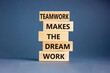© Dzmitry - Teamwork makes the dream work symbol. Concept words Teamwork makes the dream work on wooden blocks on a beautiful grey table grey background. Business Teamwork makes dream work concept. Copy space.