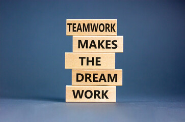 Teamwork makes the dream work symbol. Concept words Teamwork makes the dream work on wooden blocks on a beautiful grey table grey background. Business Teamwork makes dream work concept. Copy space.