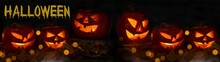 Scary Halloween Jack O' Lantern Celebration Holiday Background Banner Panorama - Spooky Carved Pumpkins And Dust In The Dark Black Night With Bokeh Lights