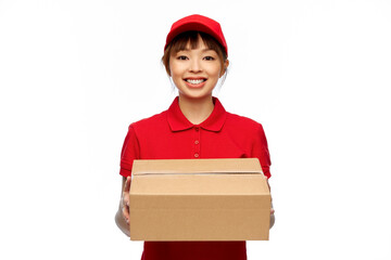 Poster - profession, job and people concept - happy smiling delivery woman in red uniform holding parcel box over white background