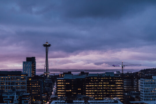 dusk blue view of seattle skyline from rooftop deck