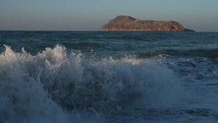 Canvas Print - Closeup of sea waves crashing on the shore of Platanias beach at Crete island in Greece. Sea wave crashing at the sea shore.