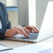 © Puwasit Inyavileart - The world of technology and internet communication, Financial professionals use laptop to calculate and check real estate earnings, Finance and Tax Technology concept.