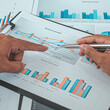 © Puwasit Inyavileart - Brainstorm team, Marketers and financial accountants are discussing and analyzing charts to plan strategies to meet customer needs, Business success concept.