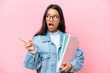 Young student Colombian woman isolated on pink background intending to realizes the solution while lifting a finger up