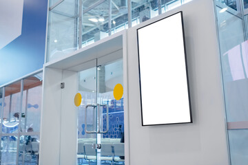 Vertical blank digital interactive white display wall at exhibition or museum with futuristic scifi interior. White screen, mock up, future, copyspace, template, technology concept