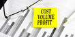© Iryna - Word COST VOLUME PROFIT on a yellow sticky on the chart background