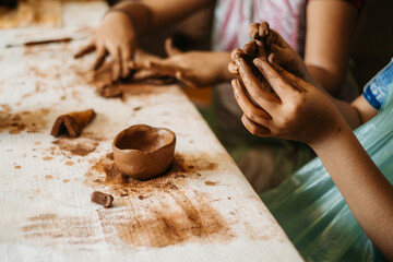 Wall Mural - children's hands sculpts clay crafts pottery school